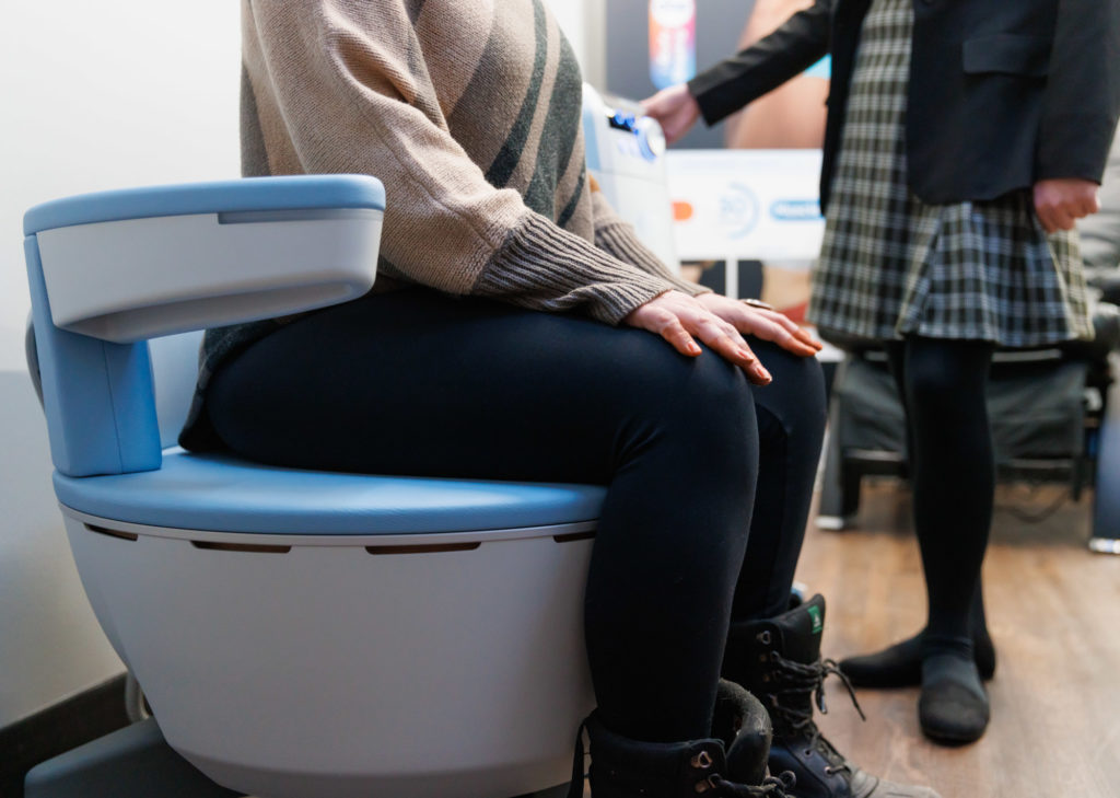 A patient tries Emsella, a top choice for a Urinary Incontinence Treatment in Oxford
