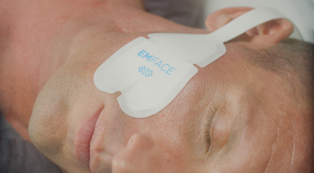 A man relaxes with Emface at medspa in Starkville