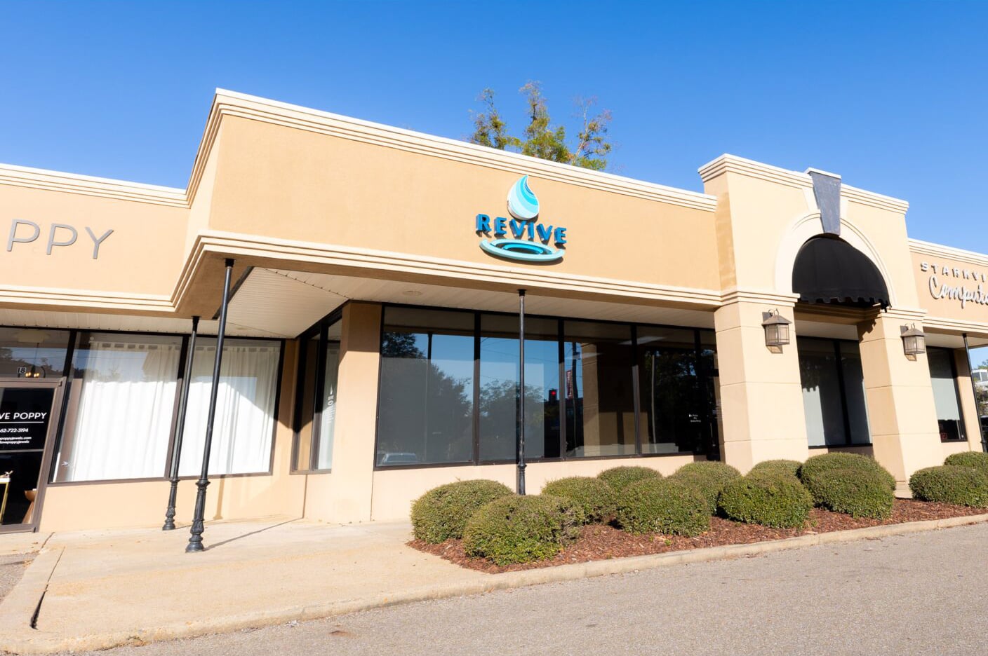 Exterior of the Revive Wellness medical spa and wellness clinic in Starkville, Mississippi, offering aesthetic treatments, hormone therapy, IV therapy, and skincare services.