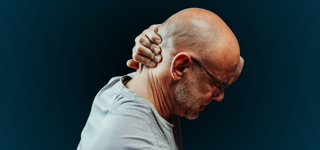 Side view of senior man holding neck with visible discomfort, highlighting neck pain relief.